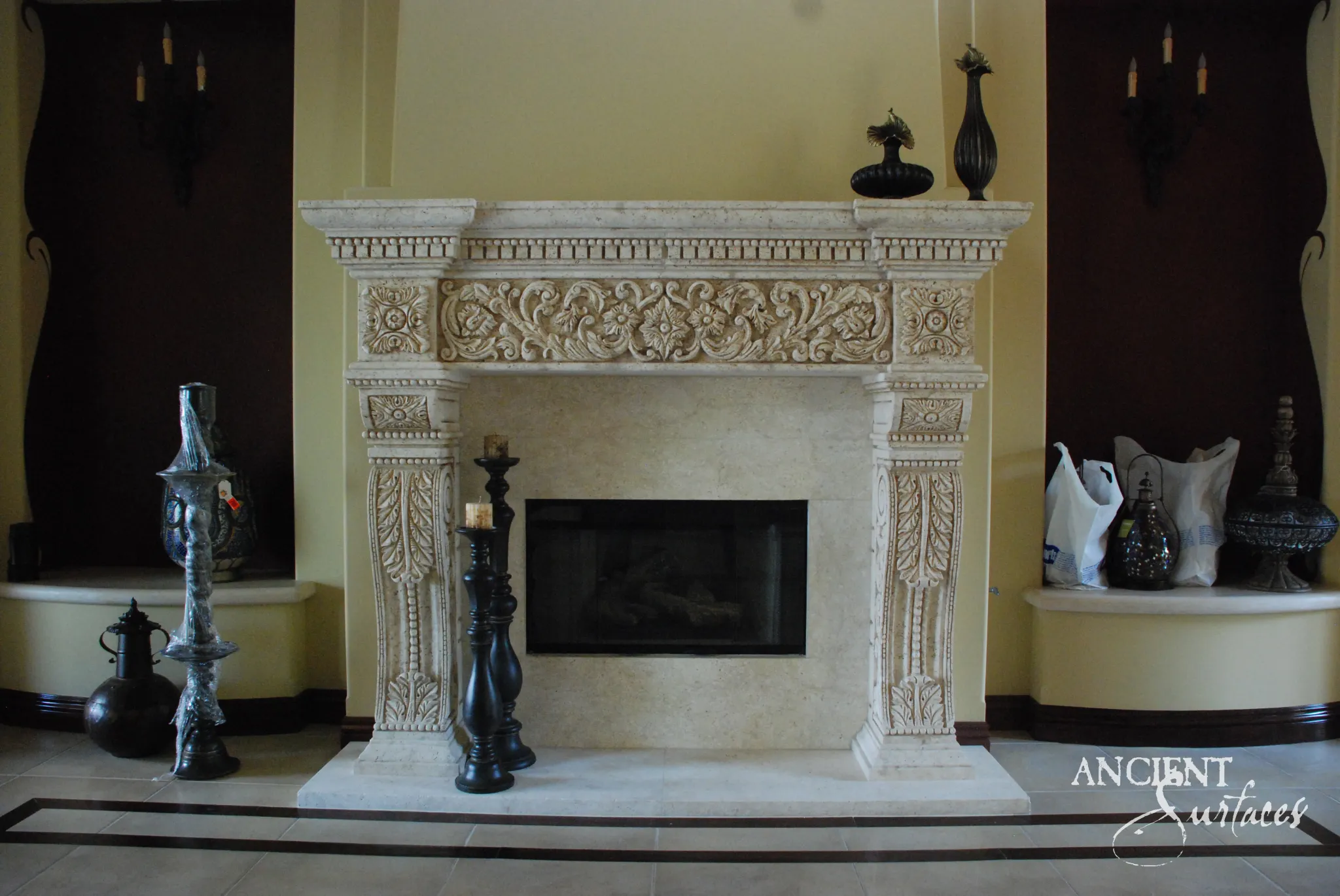 Ornate reclaimed limestone fireplace mantel with a scrolling acanthus frieze and central medallion